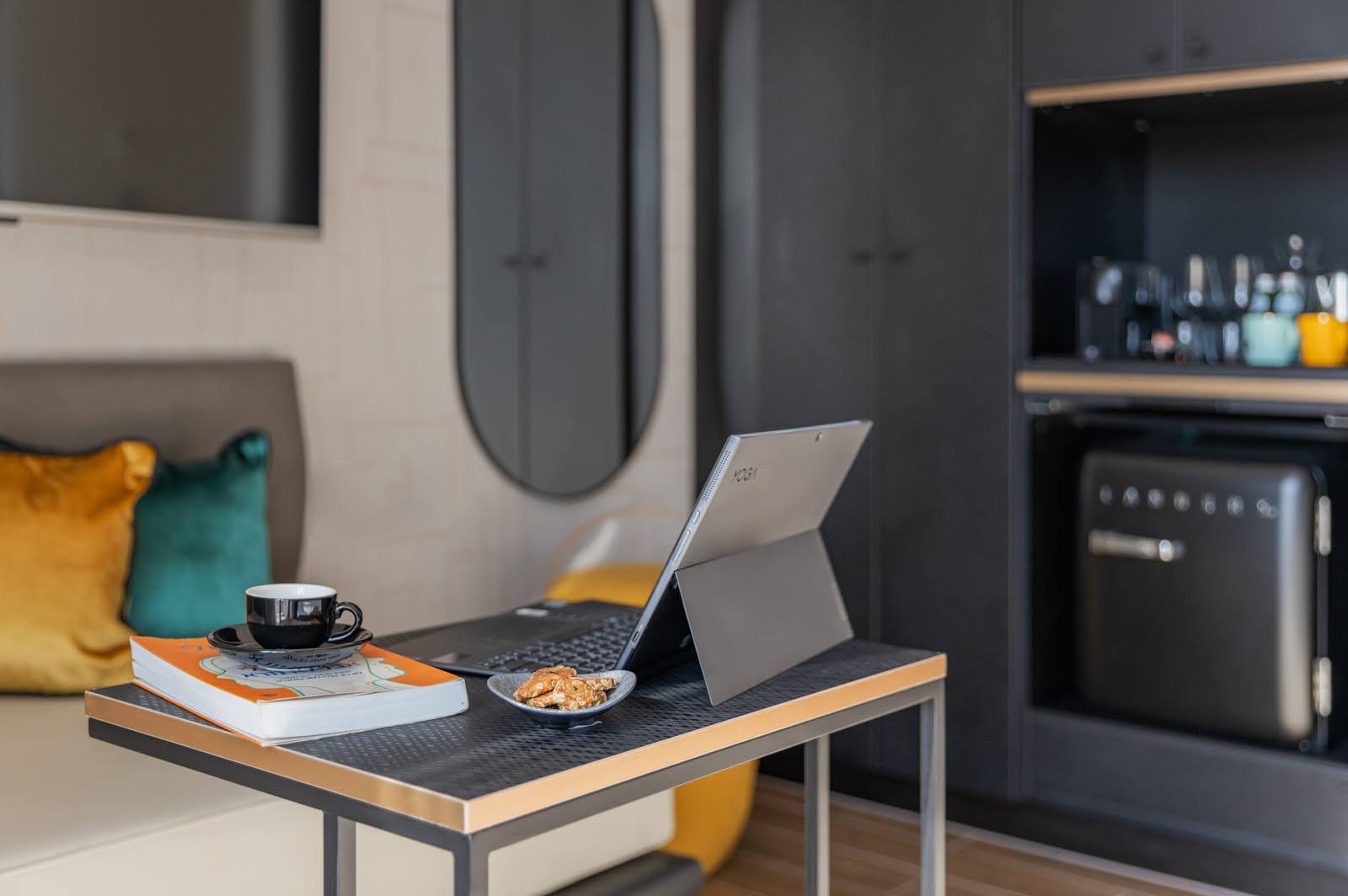 Contemporary hospitality interior with a workspace and lounge seating
